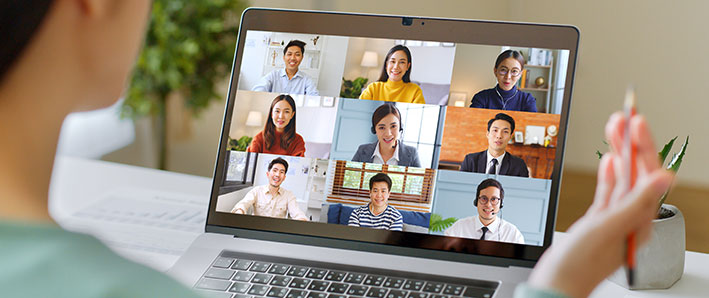 Young woman on a laptop in a Zoom meeting